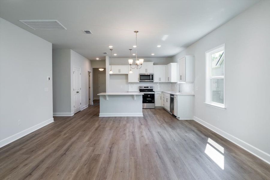 Café Area that opens to the Kitchen and gathering room. Café Area that opens to the Kitchen and gathering room.