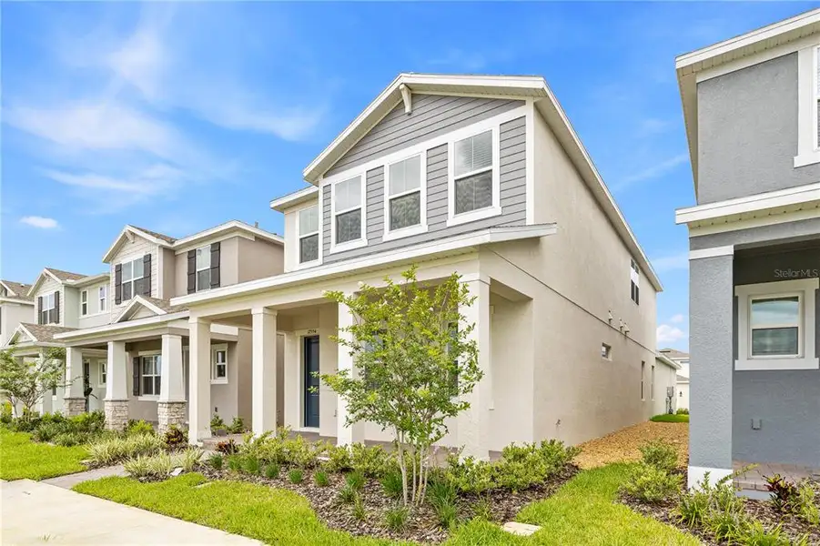 Front exterior of a new home in Osprey Ranch, Winter Garden, FL, highlighting curb appeal (Image 2).