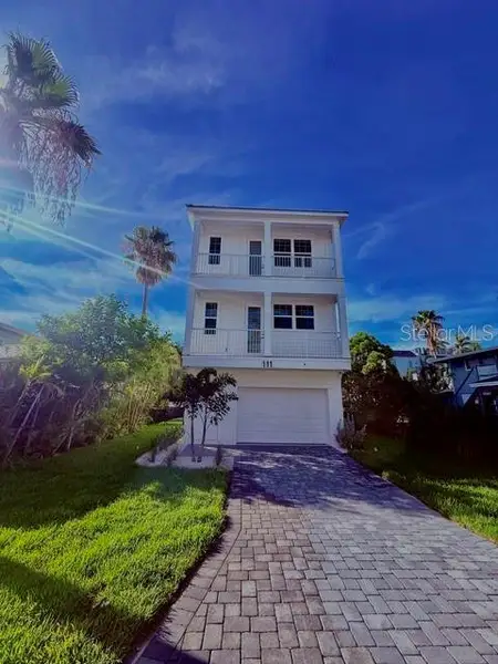 Front exterior of a new home in , Bradenton Beach, FL, highlighting curb appeal (Image 1). Front exterior of a new home in , Bradenton Beach, FL, highlighting curb appeal (Image 1).