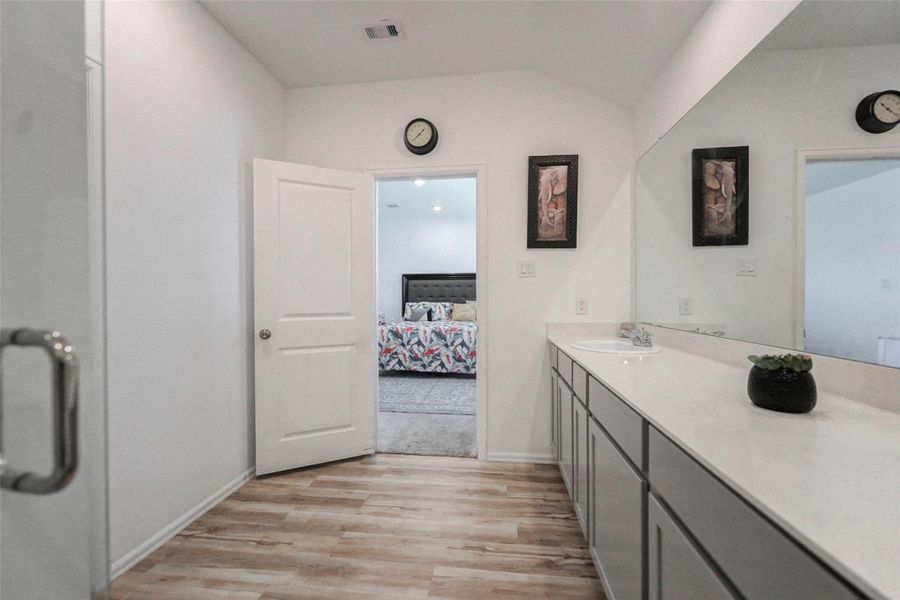 Primary bathroom offers tons of space and modern finishes. Entry to bedroom for convenient flow and privacy. Primary bathroom offers tons of space and modern finishes. Entry to bedroom for convenient flow and privacy.
