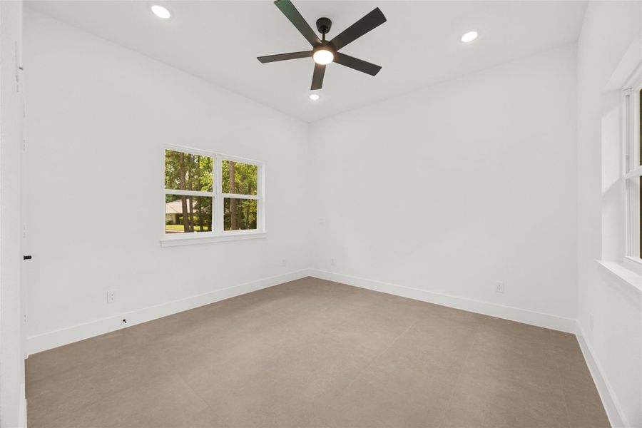 3rd bedroom with tall ceilings, abundant natural light, and modern finishes.