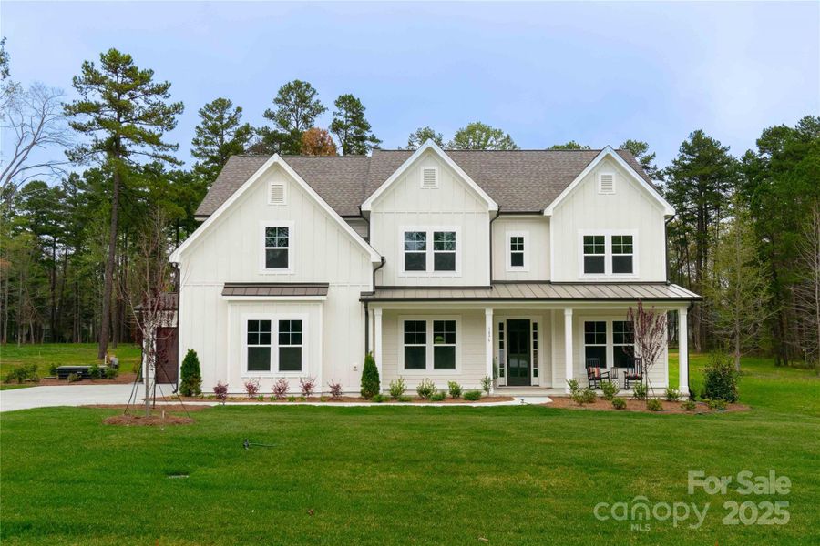 Front exterior of a new home in , Matthews, NC, highlighting curb appeal (Image 26). Front exterior of a new home in , Matthews, NC, highlighting curb appeal (Image 26).