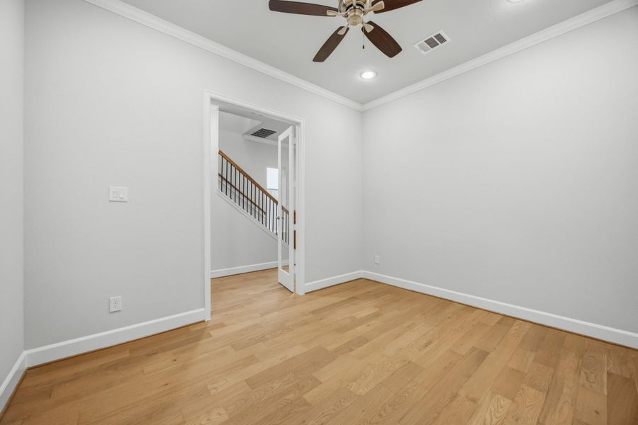 A Dreamy Spot for a Home Office Need a quiet space to work or create? This glass-doored room near the entry is ideal for a study, Zoom room, or library—with just enough privacy to stay focused.