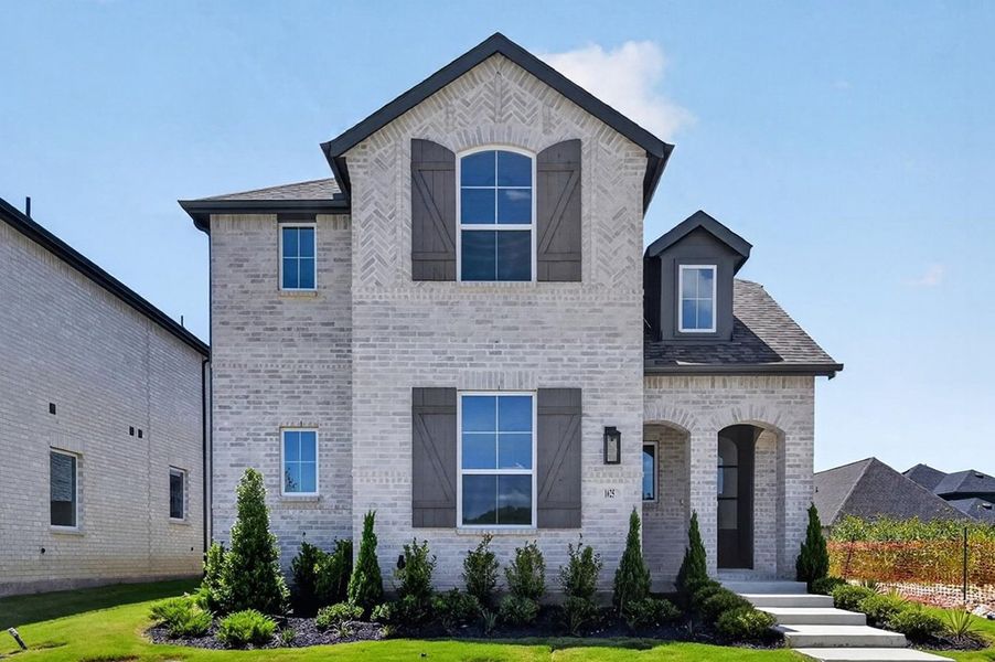 Front exterior of a new home in The Parks at Wilson Creek, Celina, TX, highlighting curb appeal (Image 1). Front exterior of a new home in The Parks at Wilson Creek, Celina, TX, highlighting curb appeal (Image 1).