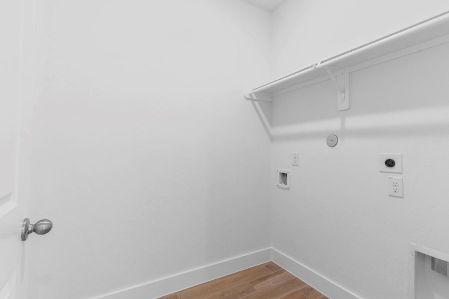 Utility room with shelving and hanging space, ready for your washer and dryer. Utility room with shelving and hanging space, ready for your washer and dryer.