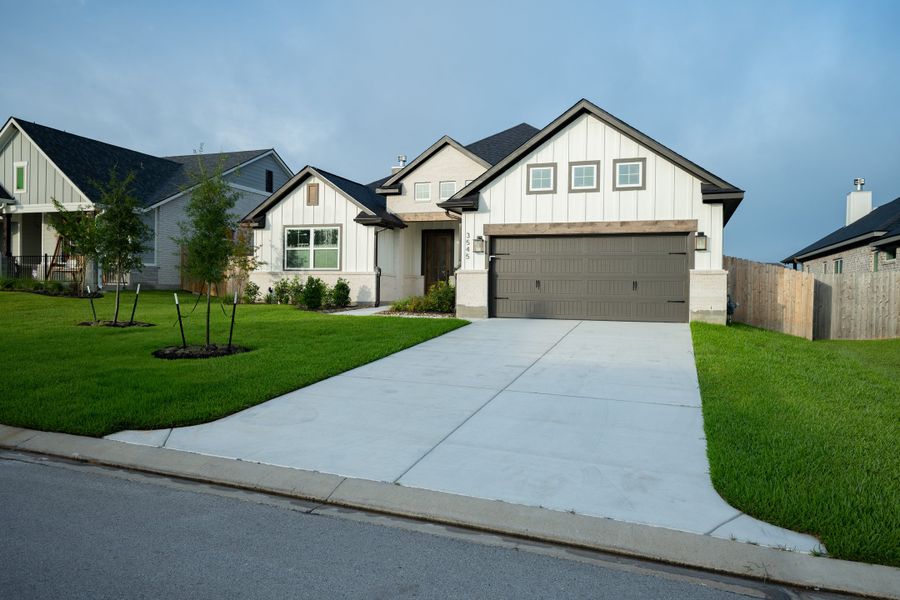 Front exterior of a new home in Greenbrier, Bryan, TX, highlighting curb appeal (Image 21).