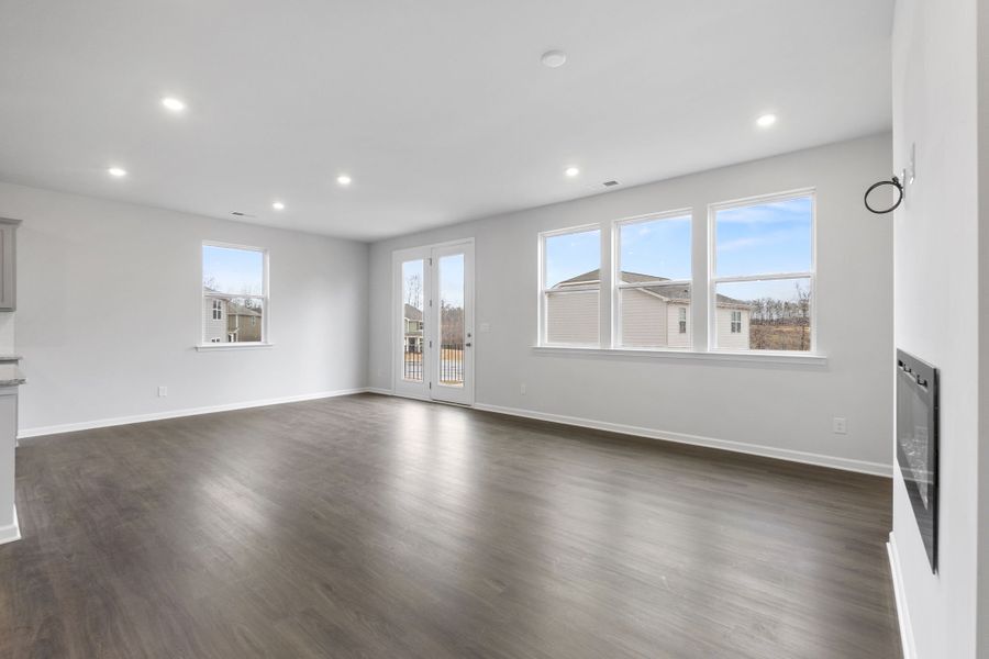 A large empty room with a large window.