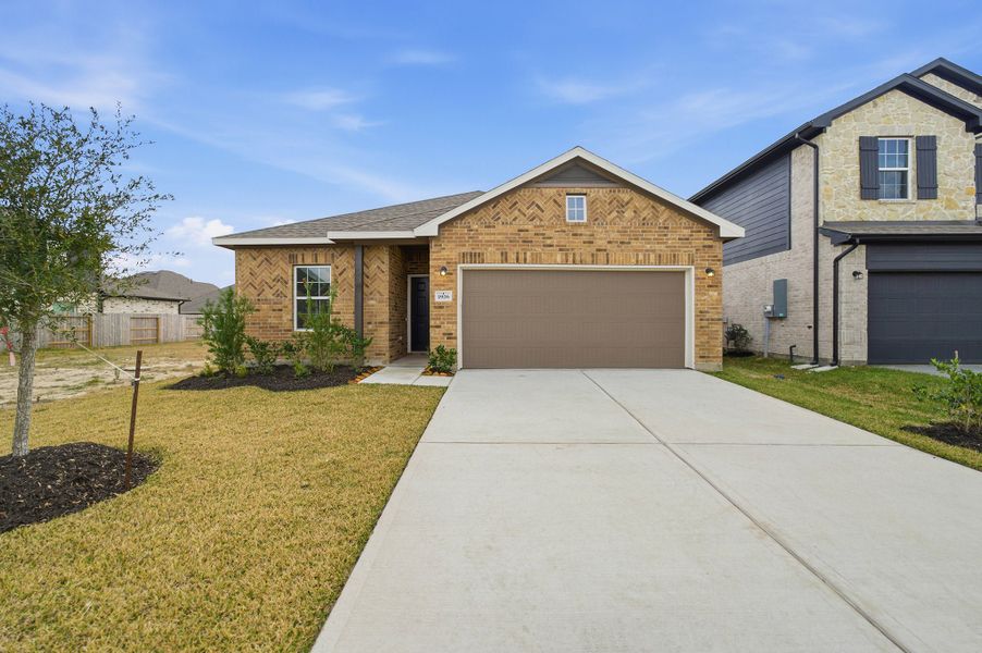 Front exterior of a new home in Windrose Green, Angleton, TX, highlighting curb appeal (Image 2). Front exterior of a new home in Windrose Green, Angleton, TX, highlighting curb appeal (Image 2).