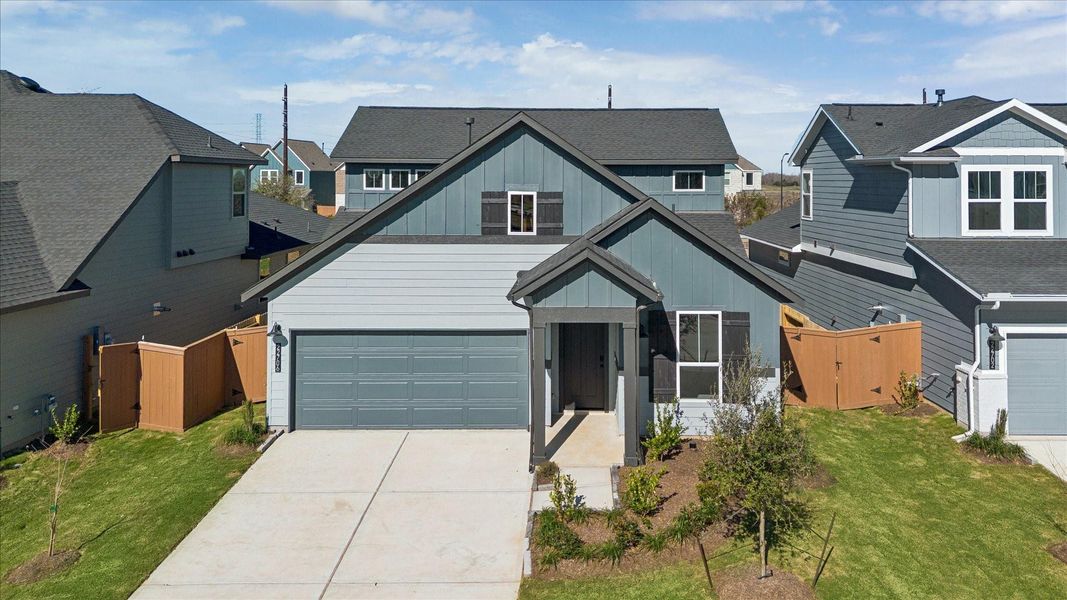 Front exterior of a new home in Elyson, Katy, TX, highlighting curb appeal (Image 2).