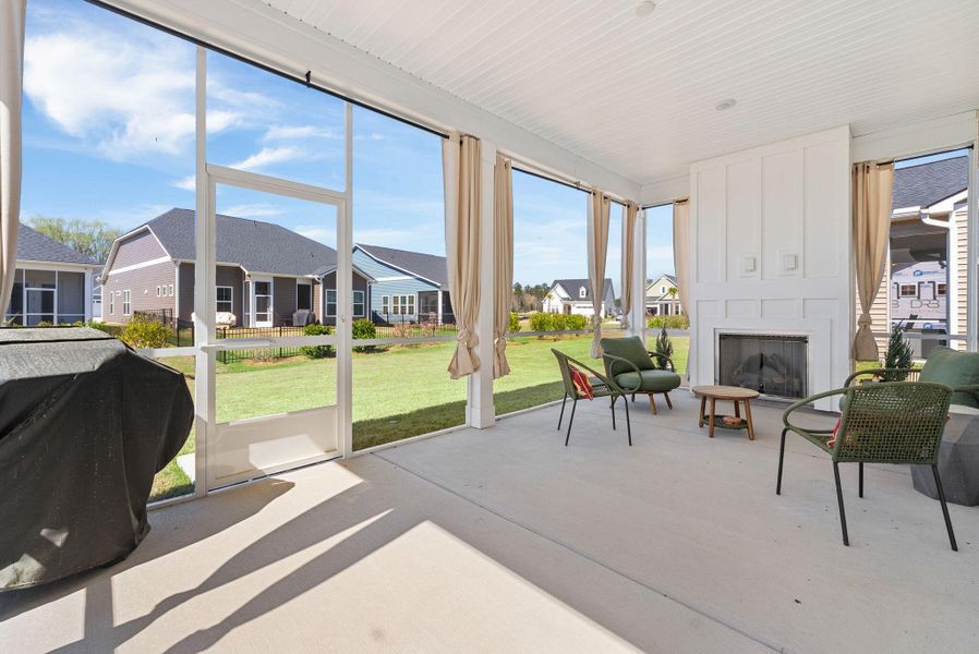 Exterior details and patio area of a home in Summerwind Crossing at Lakes of Cane Bay, Summerville (Image 3).