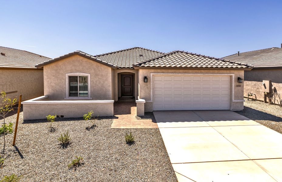 Front exterior of a new home in El Rancho Santa Rosa, Maricopa, AZ, highlighting curb appeal (Image 19). Front exterior of a new home in El Rancho Santa Rosa, Maricopa, AZ, highlighting curb appeal (Image 19).