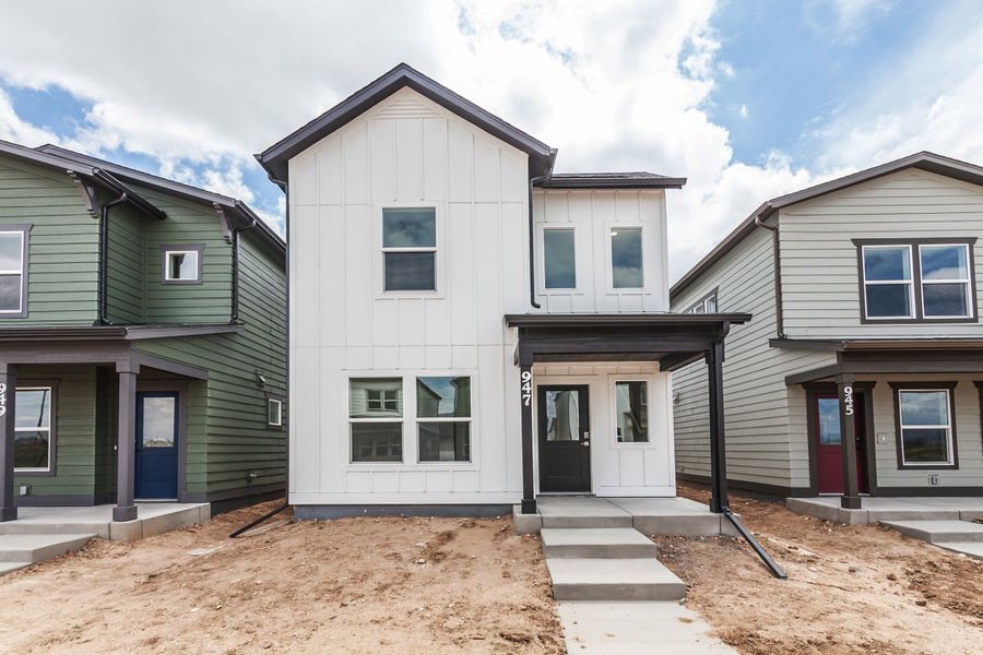 Front exterior of a new home in Prairie Song, Windsor, CO, highlighting curb appeal (Image 1). Front exterior of a new home in Prairie Song, Windsor, CO, highlighting curb appeal (Image 1).