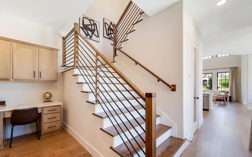 Representative furnished interior of a home built from the Rainier by CastleRock Communities in The Summit at Center Stage, Keller (Image 14).
