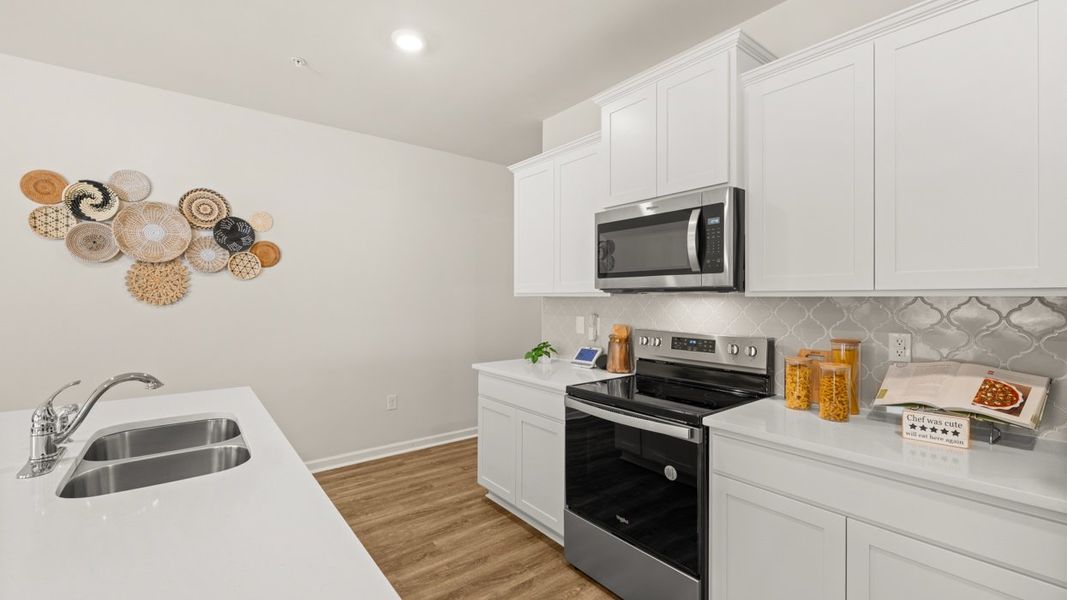 Representative furnished interior of a home built from the Stratford by D.R. Horton in Echo Glen, Stockbridge (Image 5).