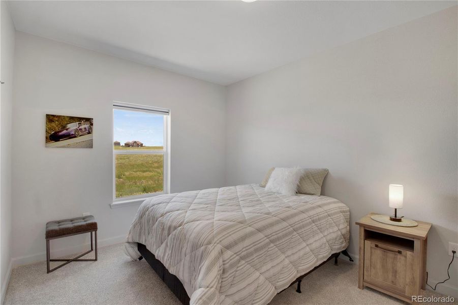 Bathroom #2 featuring vanity and shower / bath combination with custom tile