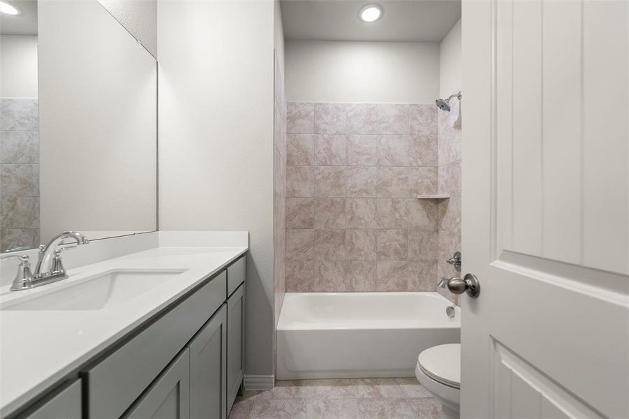 Full bathroom with shower combination, vanity, and recessed lighting Full bathroom with shower combination, vanity, and recessed lighting