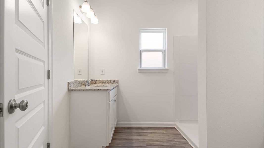 Representative furnished interior of a home built from the Aspen by D.R. Horton in Owl's Head East, Freeport (Image 14).