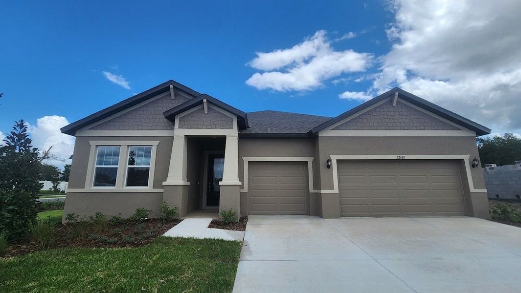 Front exterior of a new home in Pinecone Reserve, Brooksville, FL, highlighting curb appeal (Image 2).
