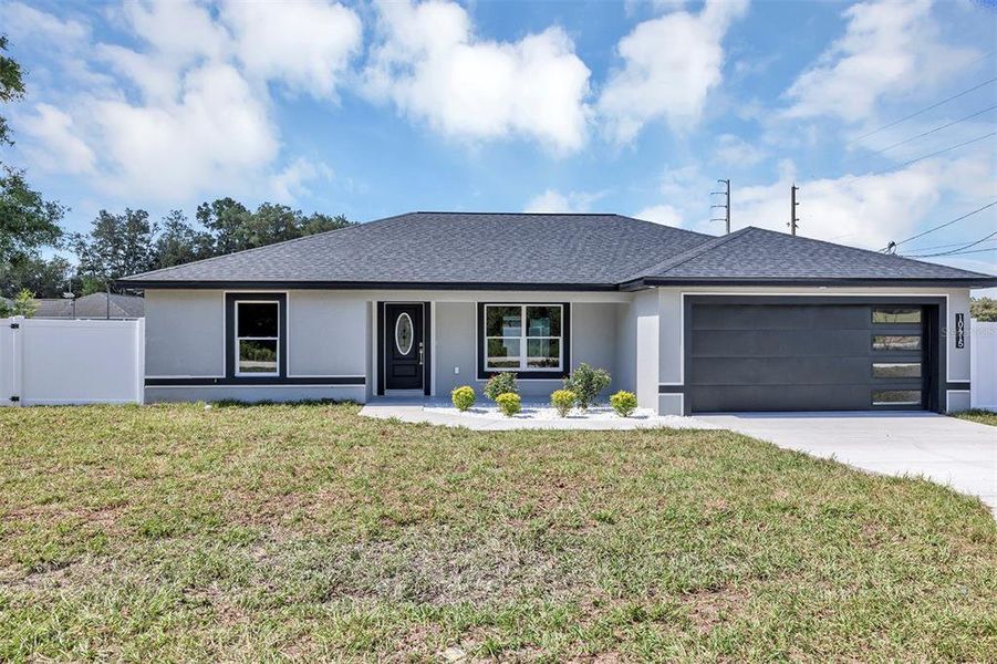 Front exterior of a new home in , Dunnellon, FL, highlighting curb appeal (Image 2). Front exterior of a new home in , Dunnellon, FL, highlighting curb appeal (Image 2).