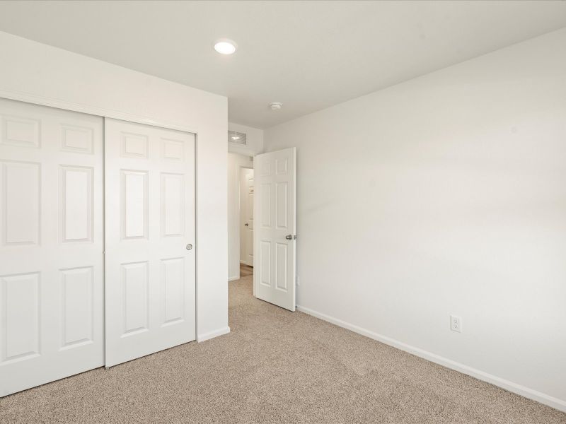 Spacious, unfurnished interior of a new home in Lorson Ranch: The Trail Collection, Colorado Springs (Image 9).