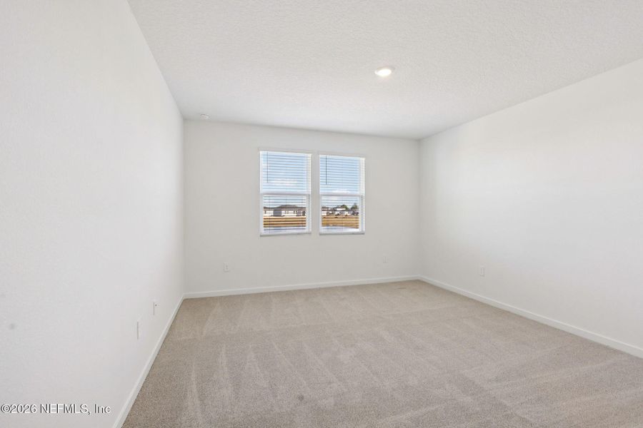 Spacious, unfurnished interior of a new home in Lakes at Bella Lago - Signature Series, Green Cove Springs (Image 36).