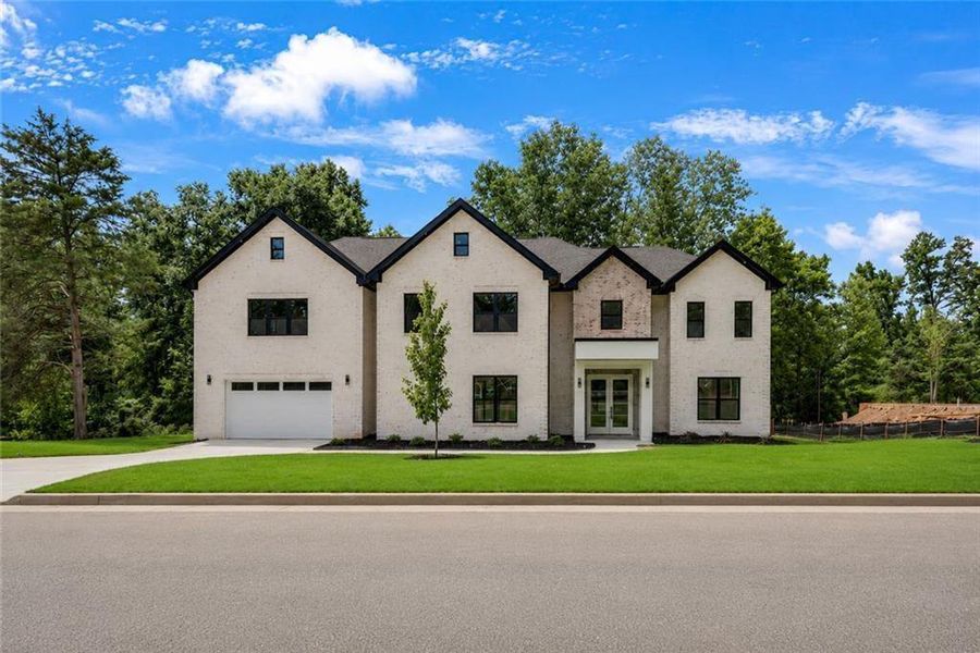Front exterior of a new home in , Snellville, GA, highlighting curb appeal (Image 31). Front exterior of a new home in , Snellville, GA, highlighting curb appeal (Image 31).
