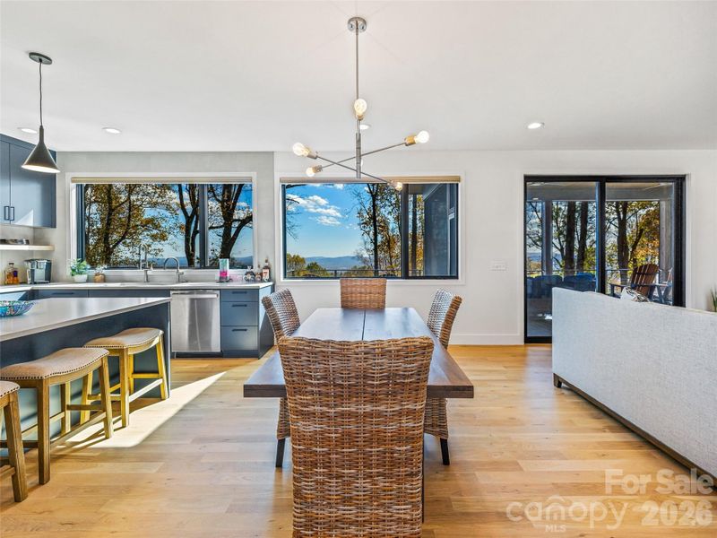 Kitchen, dining, and living room with the open floor plan. Kitchen, dining, and living room with the open floor plan.