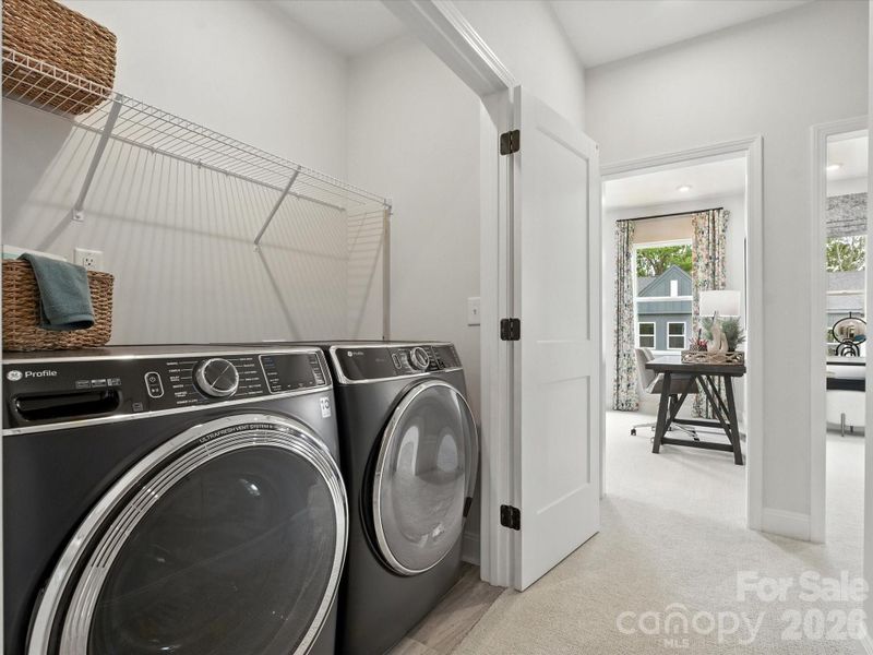 Laundry closet with GE Front Load Electric Laundry Set in Sapphire Blue Laundry closet with GE Front Load Electric Laundry Set in Sapphire Blue