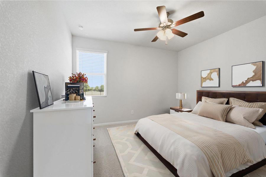 Bedroom with light colored carpet and ceiling fan