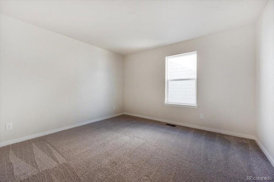 Spacious, unfurnished interior of a new home in The Boulevard II Collection at Windler, Aurora (Image 21).