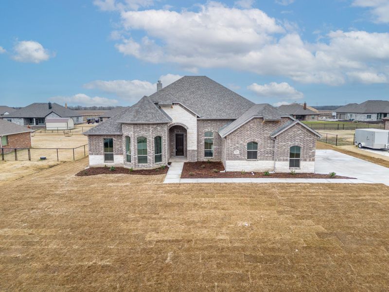 Representative exterior photo of a completed home built from the Jude by Robbie Hale Homes in High Meadows Estates, Nevada, TX (Image 26).