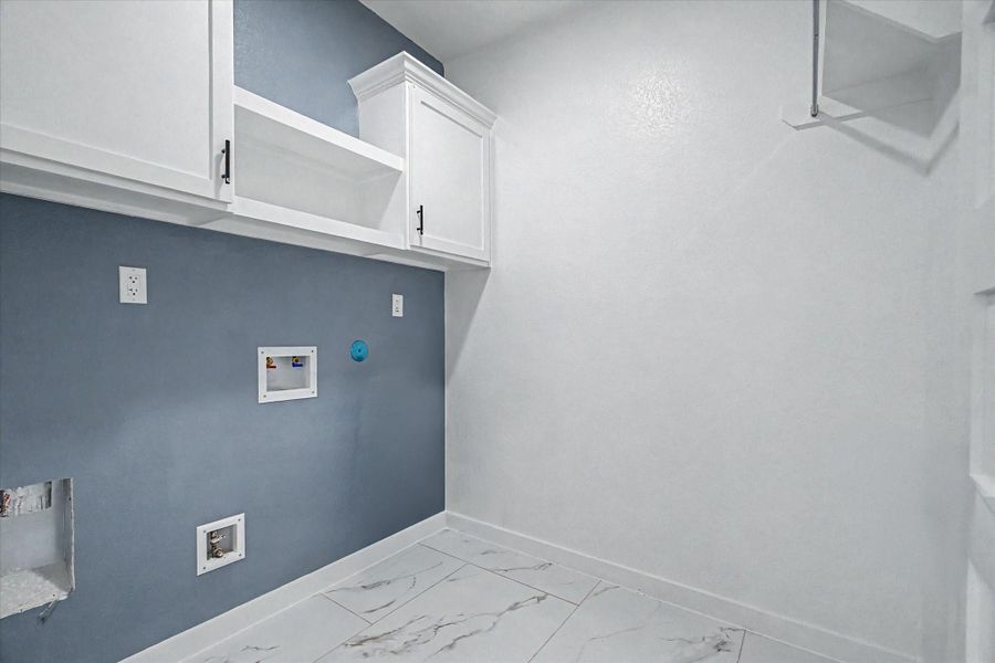 Large laundry room w/ cabinetry for convenience and efficiency Large laundry room w/ cabinetry for convenience and efficiency