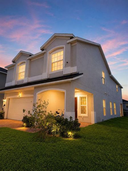 Front exterior of a new home in , Davenport, FL, highlighting curb appeal (Image 1). Front exterior of a new home in , Davenport, FL, highlighting curb appeal (Image 1).