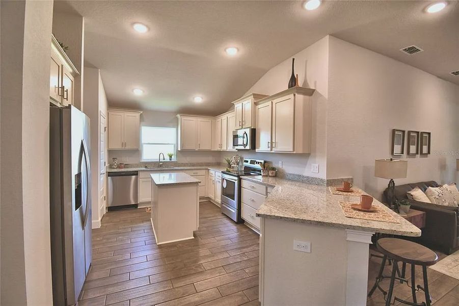 Furnished interior view inside a new home in Magnolia Park, Haines City (Image 10).