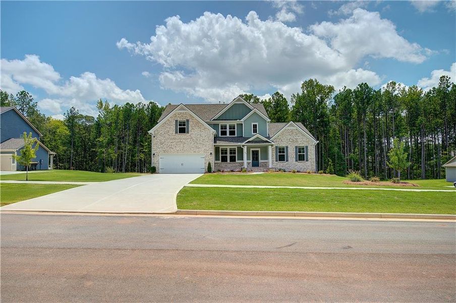 Front exterior of a new home in Saddleridge, Senoia, GA, highlighting curb appeal (Image 20).