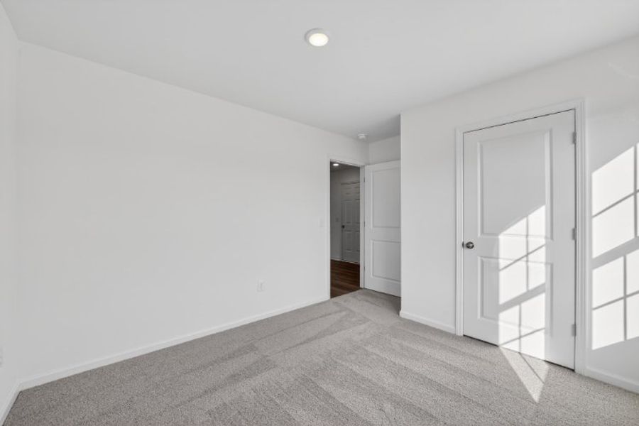 A hallway with white doors.
