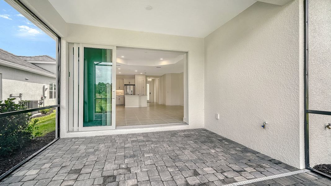 Exterior details and patio area of a home in Windward Real Estate and Homes for Sale in Sarasota, FL - Neal Communities, Lakewood Ranch (Image 3).