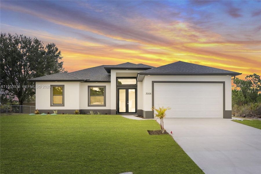 Front exterior of a new home in , Lehigh Acres, FL, highlighting curb appeal (Image 14).