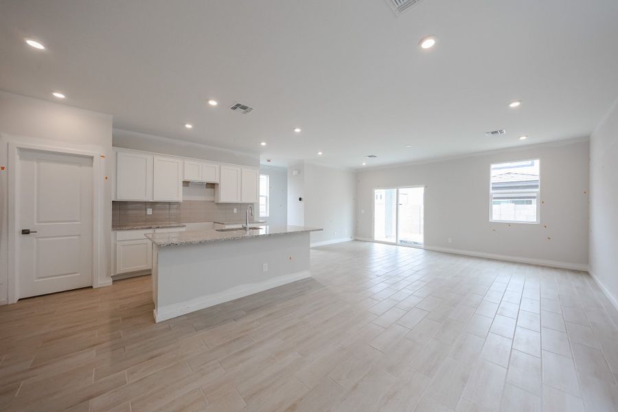 A large empty kitchen. A large empty kitchen.