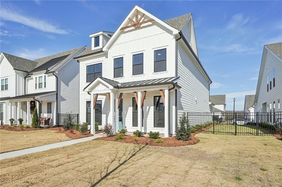 Front exterior of a new home in Promenade at Sawnee Village, Cumming, GA, highlighting curb appeal (Image 1). Front exterior of a new home in Promenade at Sawnee Village, Cumming, GA, highlighting curb appeal (Image 1).