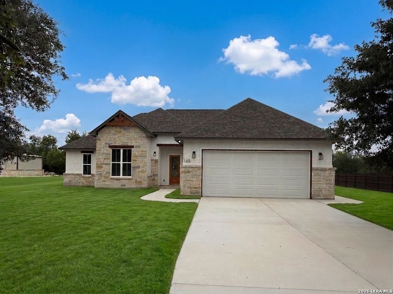 Front exterior of a new home in , Lytle, TX, highlighting curb appeal (Image 29).