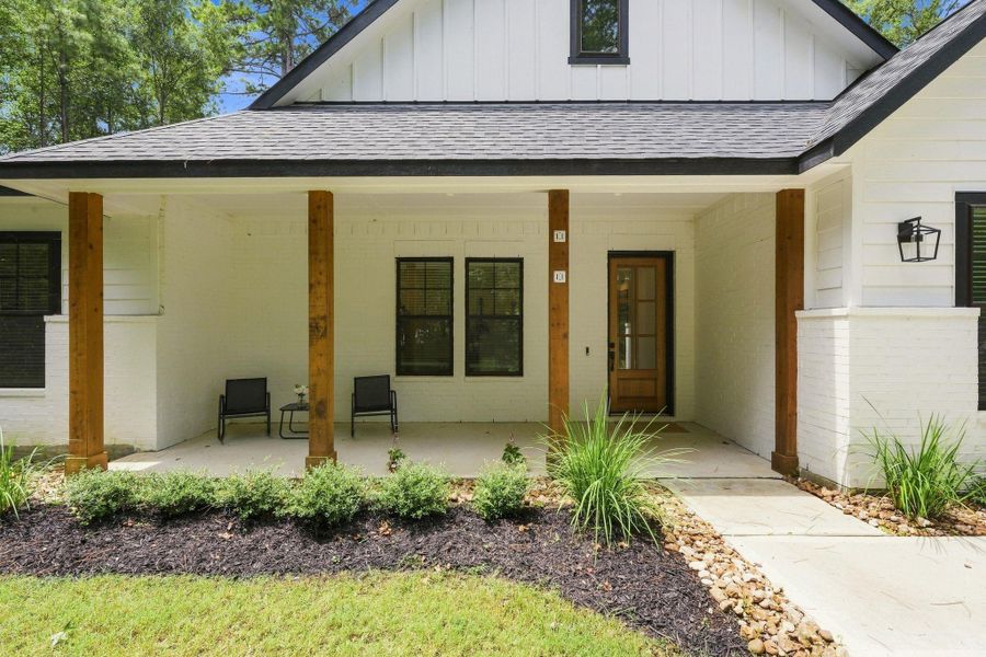 Exterior details and patio area of a home in , New Waverly (Image 23).