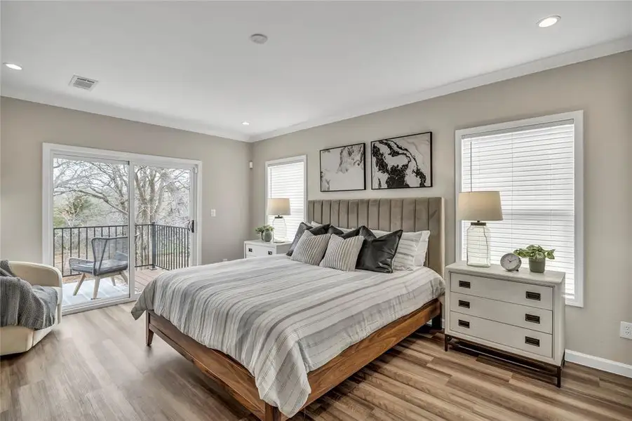 Bedroom with recessed lighting, crown molding, access to outside, and wood finished floors