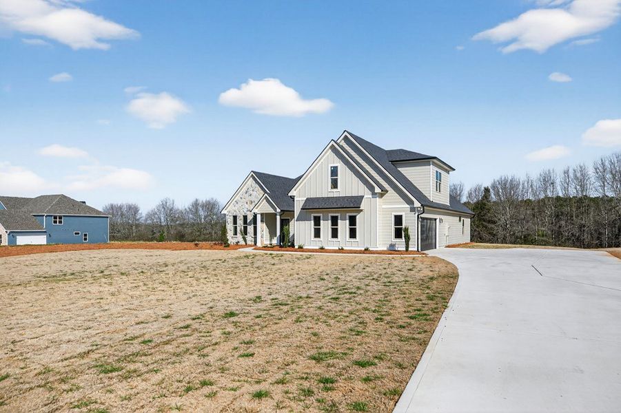 Front exterior of a new home in Blackwelder Bluff, Bowdon, GA, highlighting curb appeal (Image 26).