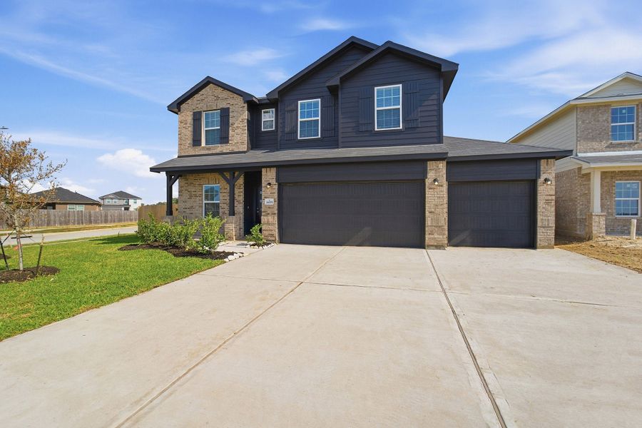 Front exterior of a new home in Pecan Estates, Crosby, TX, highlighting curb appeal (Image 2).