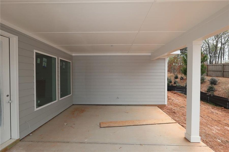 Exterior details and patio area of a home in Maple Grove at Towne Lake, Woodstock (Image 1). Exterior details and patio area of a home in Maple Grove at Towne Lake, Woodstock (Image 1).