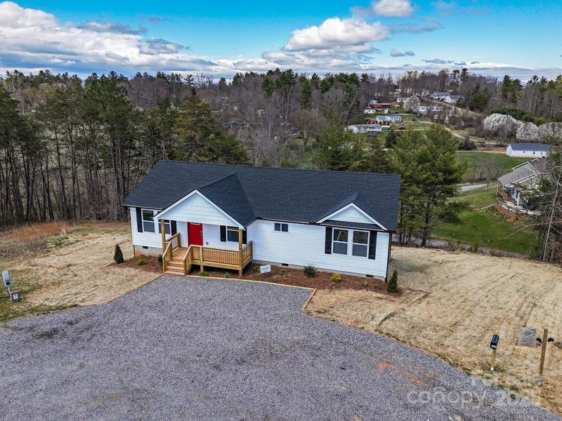 Front exterior of a new home in , Weaverville, NC, highlighting curb appeal (Image 22). Front exterior of a new home in , Weaverville, NC, highlighting curb appeal (Image 22).