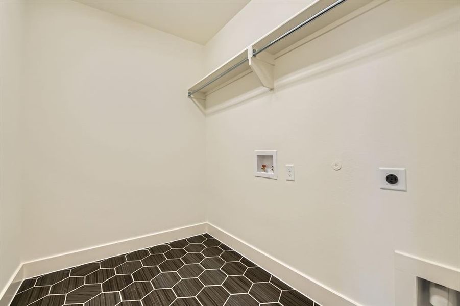 Washroom with washer hookup, laundry area, baseboards, and hookup for an electric dryer