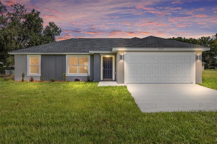 Front exterior of a new home in , Dunnellon, FL, highlighting curb appeal (Image 2).