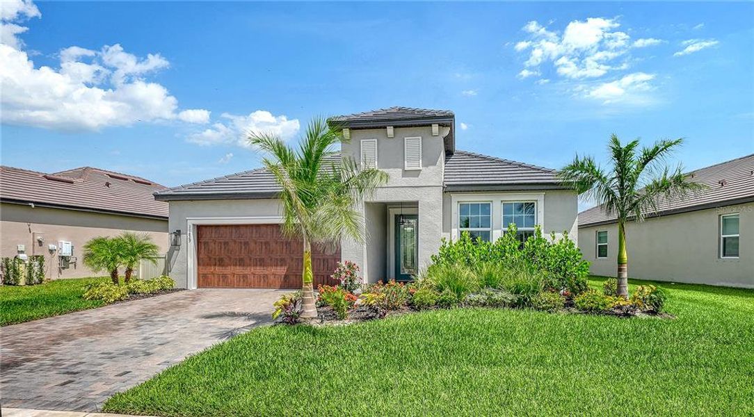 Front exterior of a new home in , Parrish, FL, highlighting curb appeal (Image 2). Front exterior of a new home in , Parrish, FL, highlighting curb appeal (Image 2).